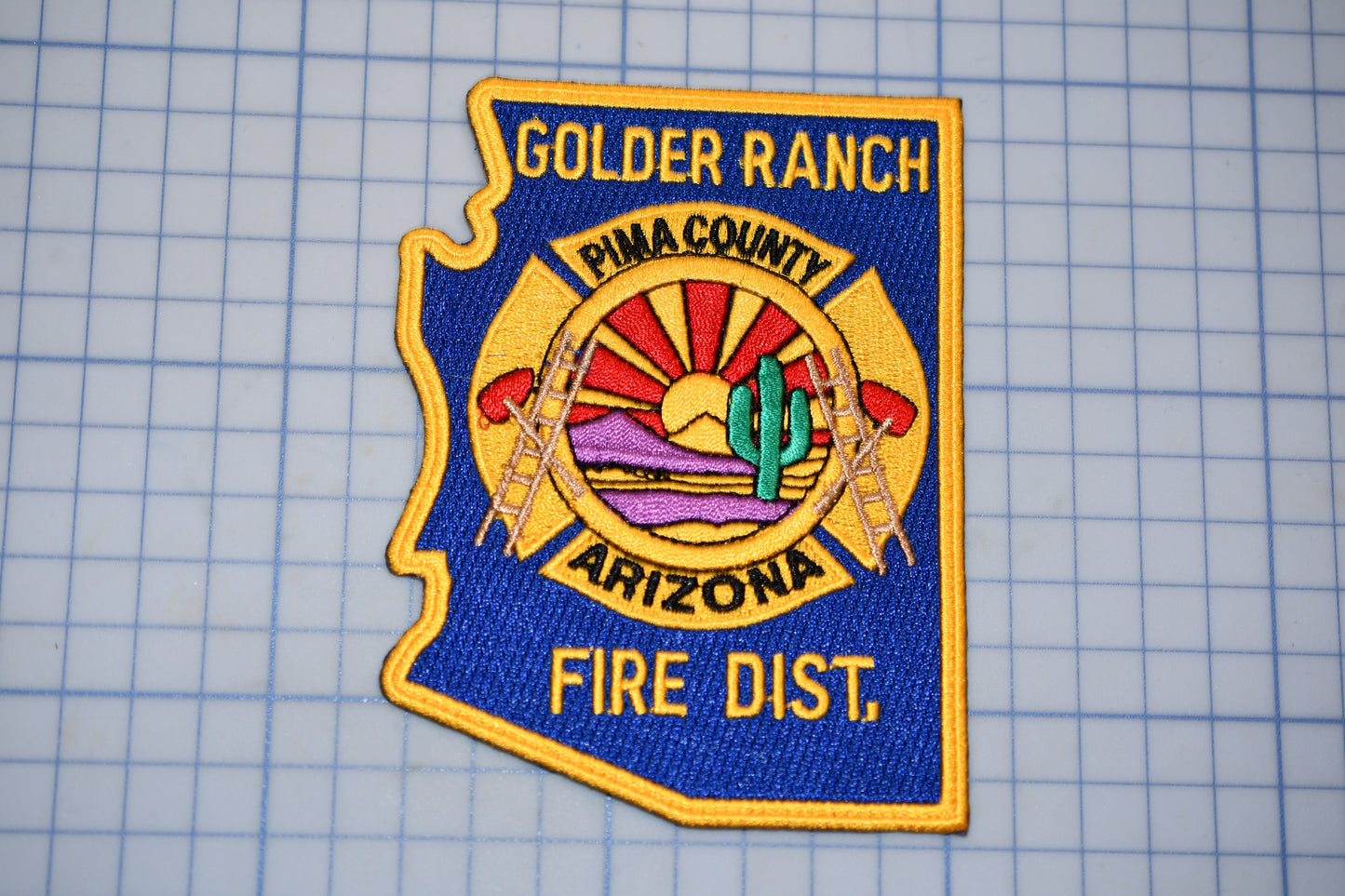 a fire department patch on a cutting board