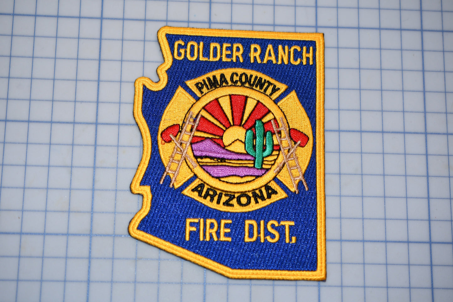 a fire department patch on a cutting board