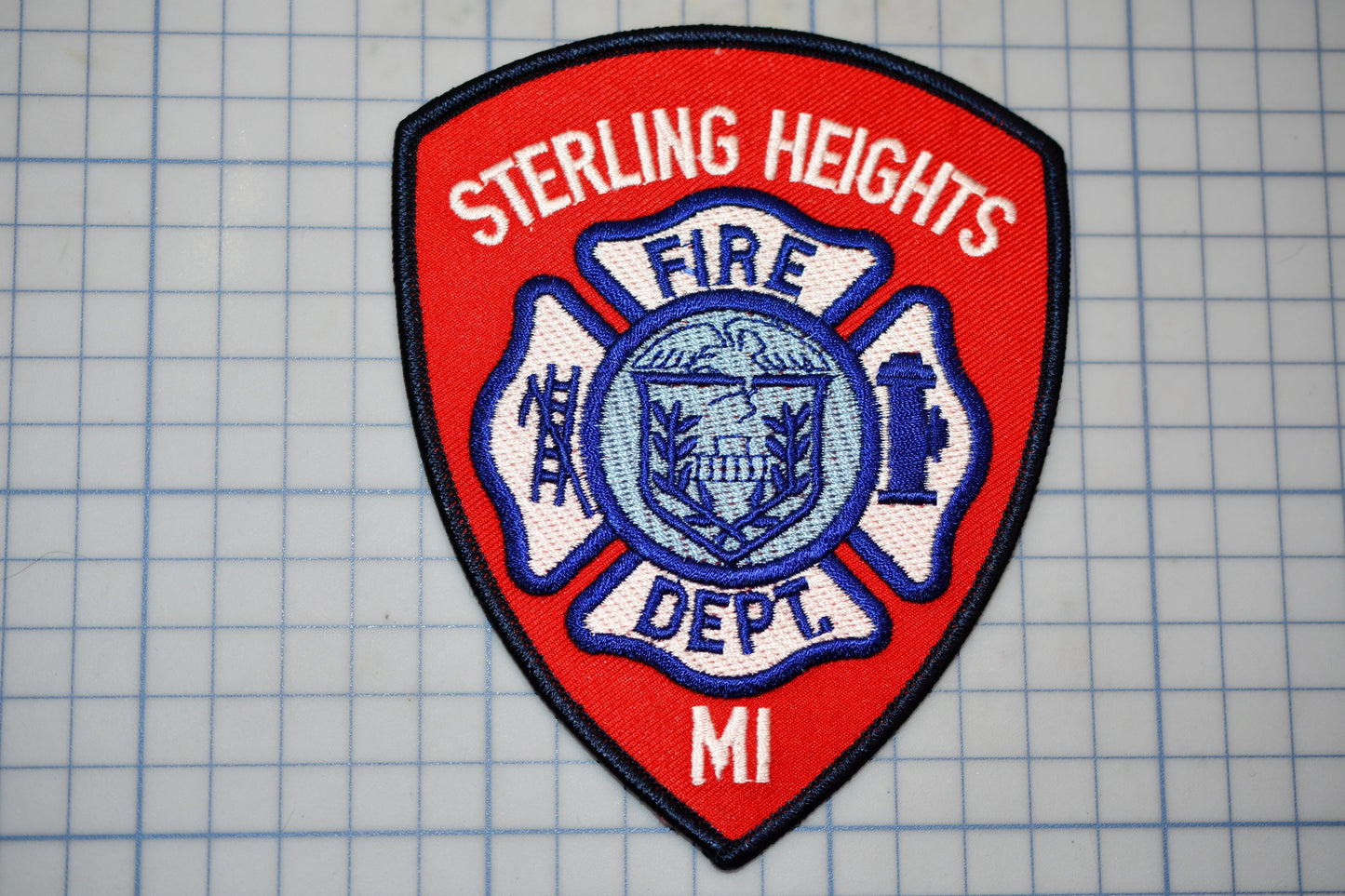 a fire department patch on a cutting board