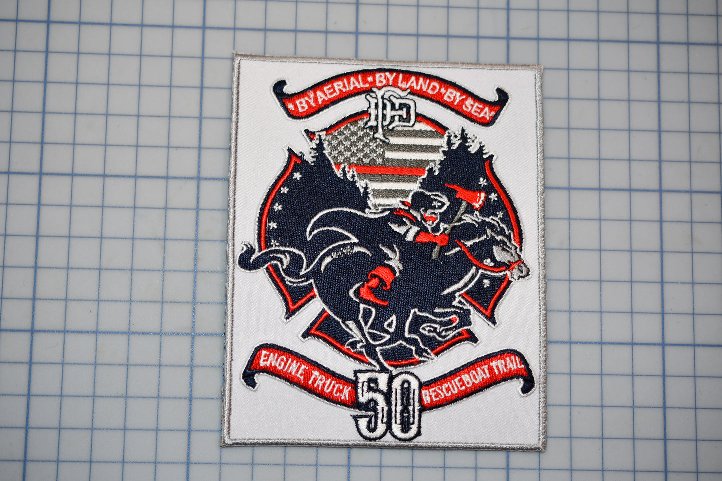 a patch with a picture of a horse and a flag on it