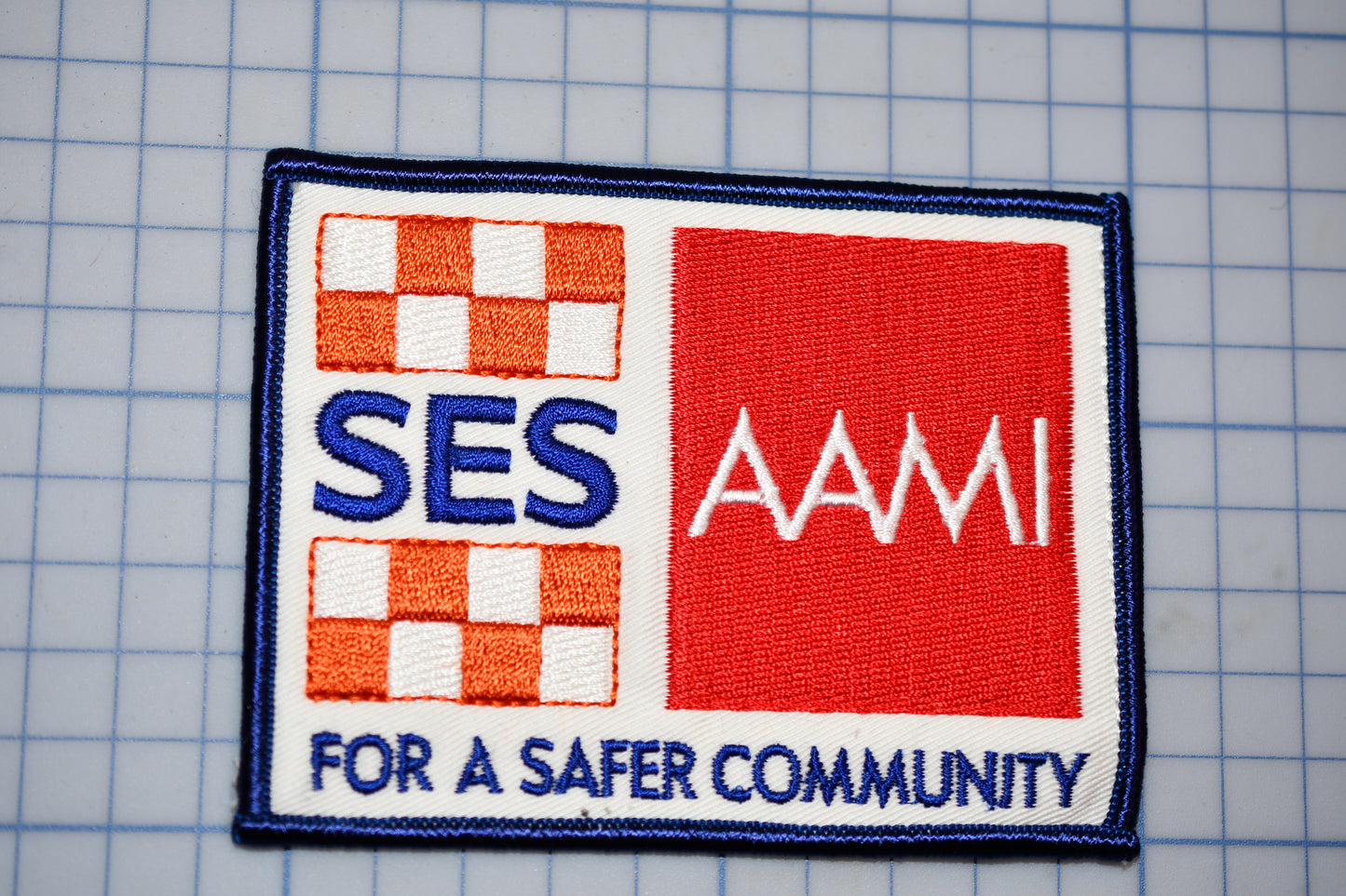 a patch that says ses a m for a safer community