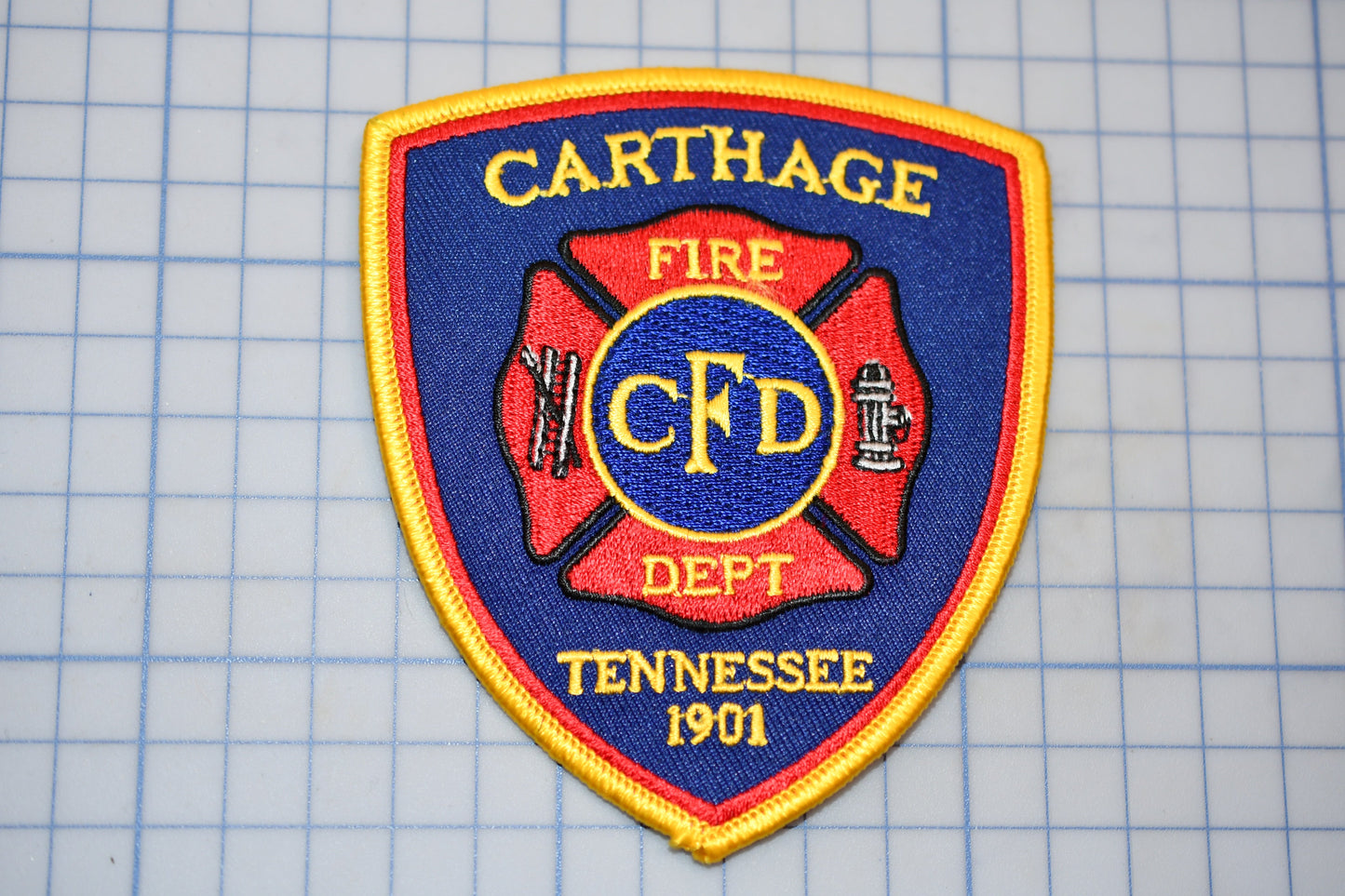 a fire department patch on a cutting board