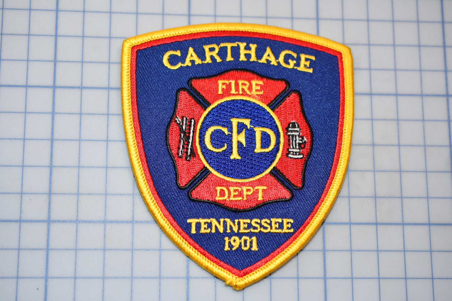 a fire department patch on a cutting board