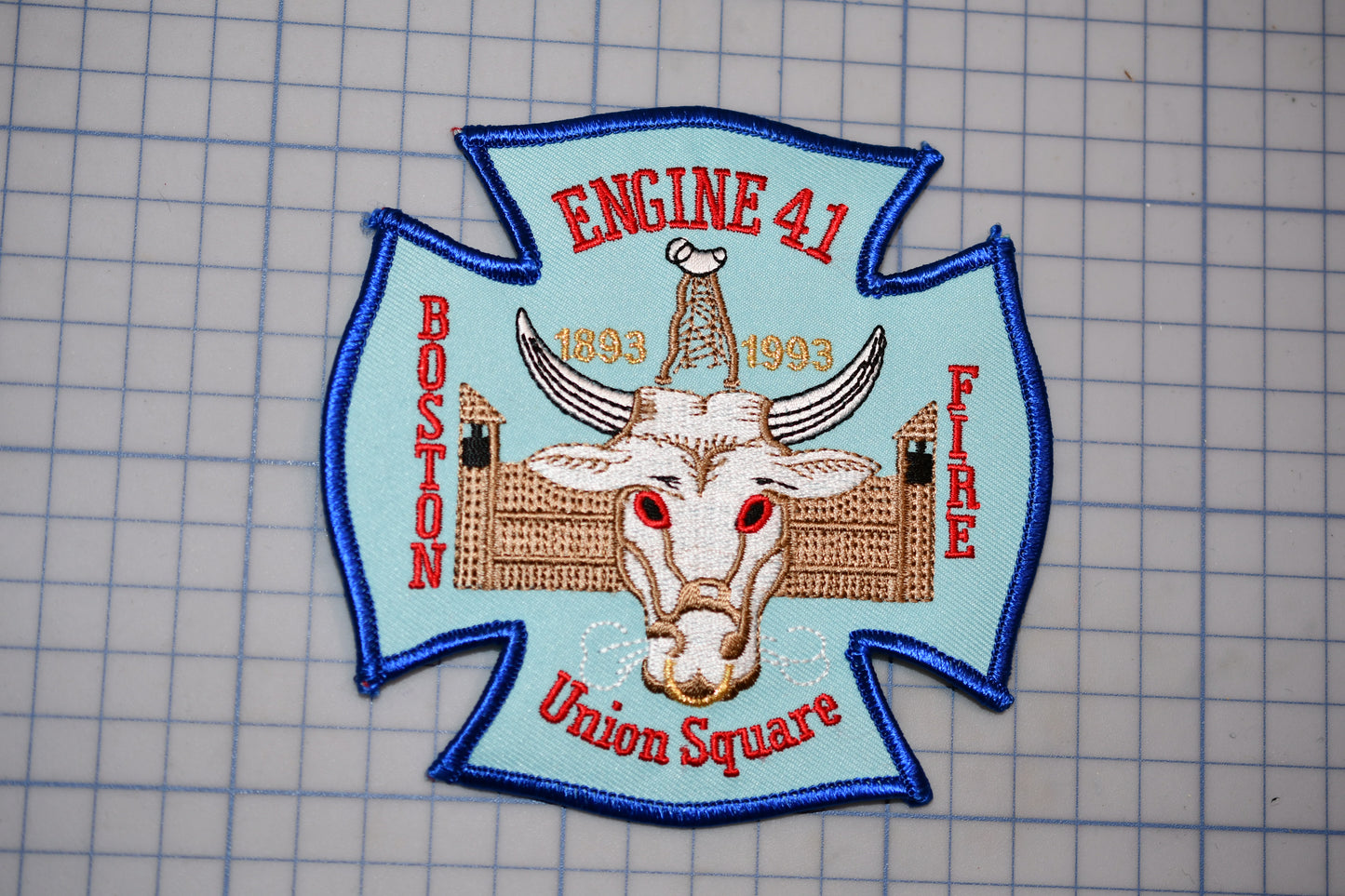 a fire department patch with a bull's head and the text "Engine 41 Boston Fire Union Square" on it.