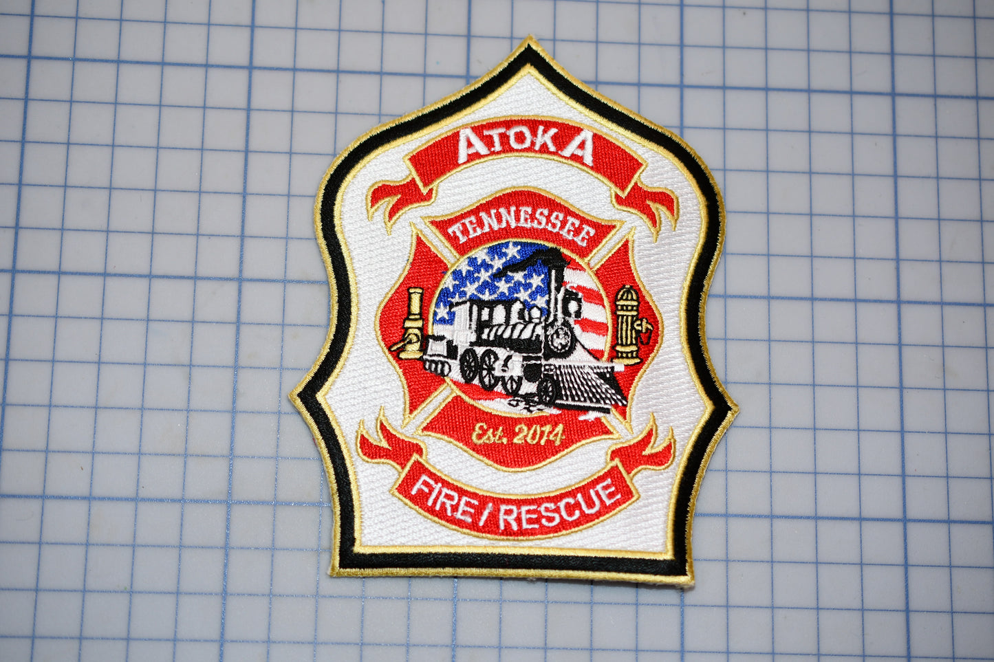 a patch with a fire department emblem on it
