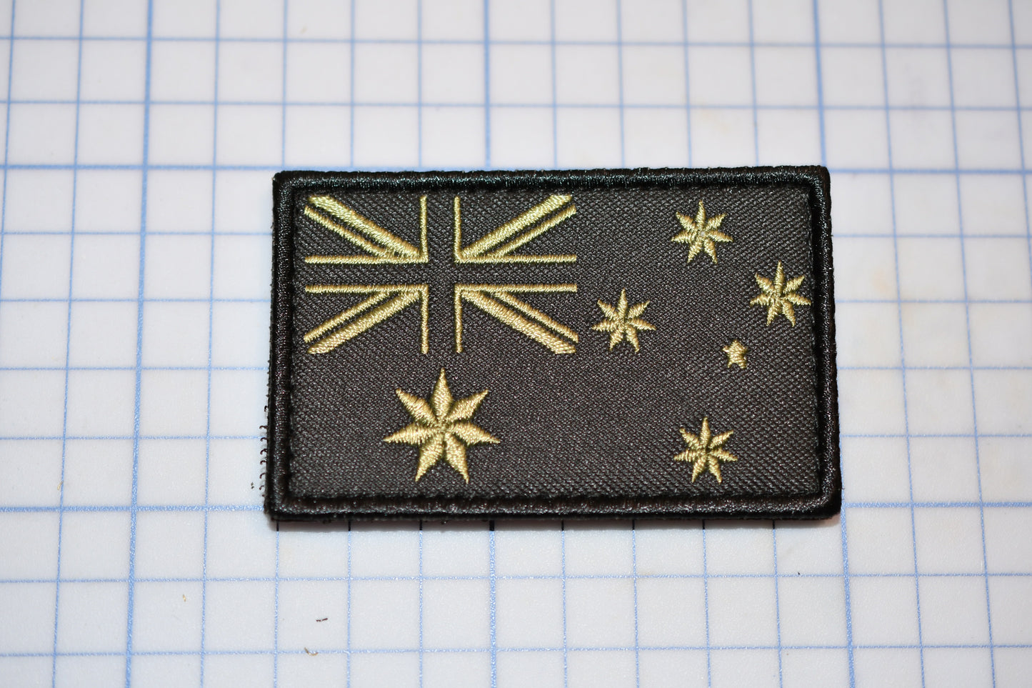 a black patch with gold stars on it