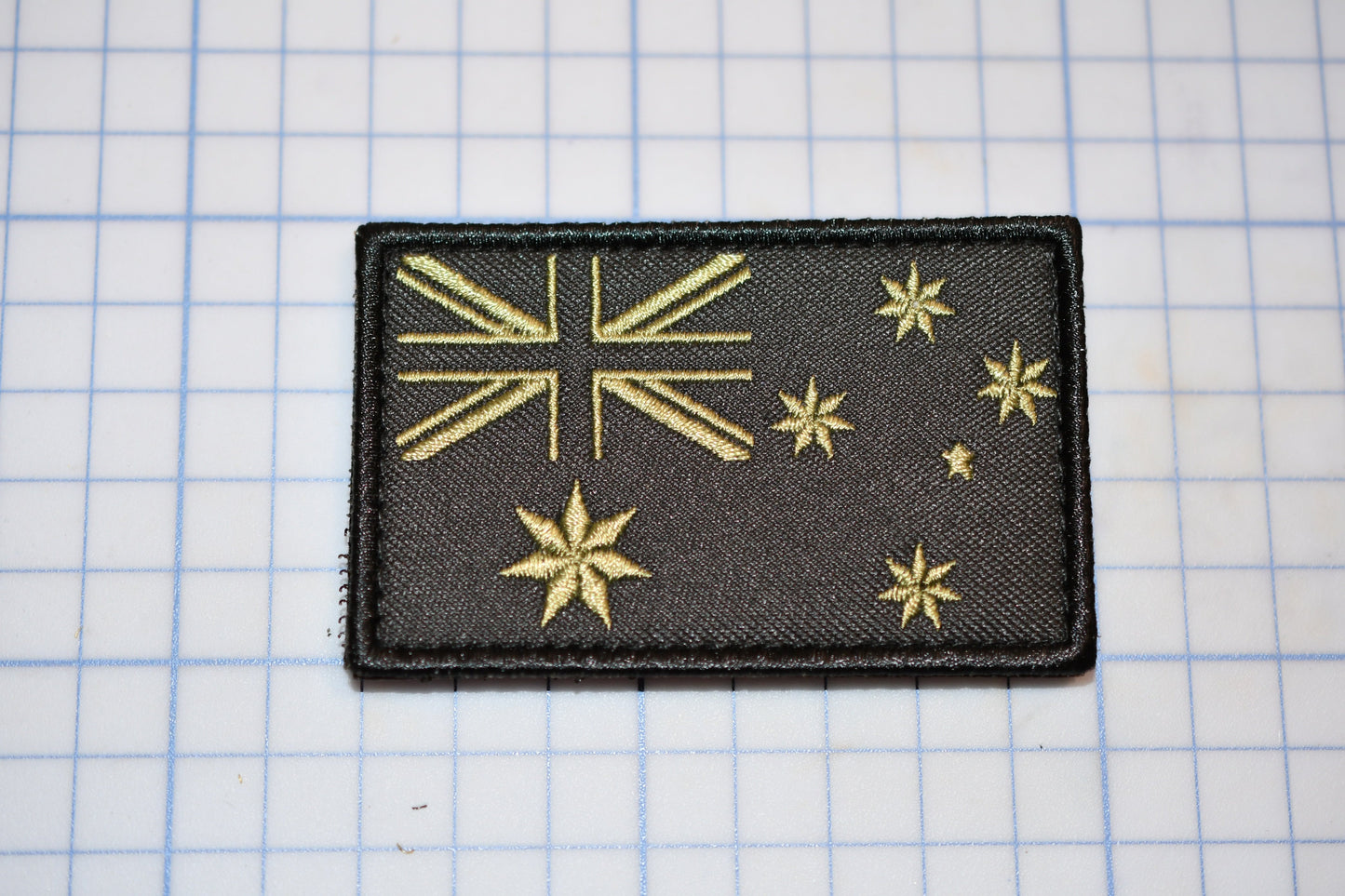 a black patch with gold stars on it