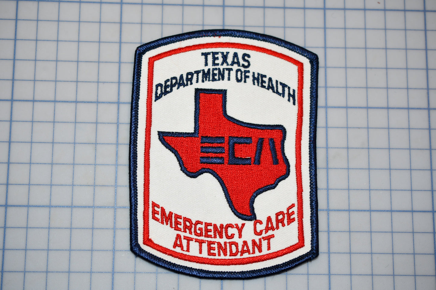 a Texas Department of Health Emergency Care Attendant patch.