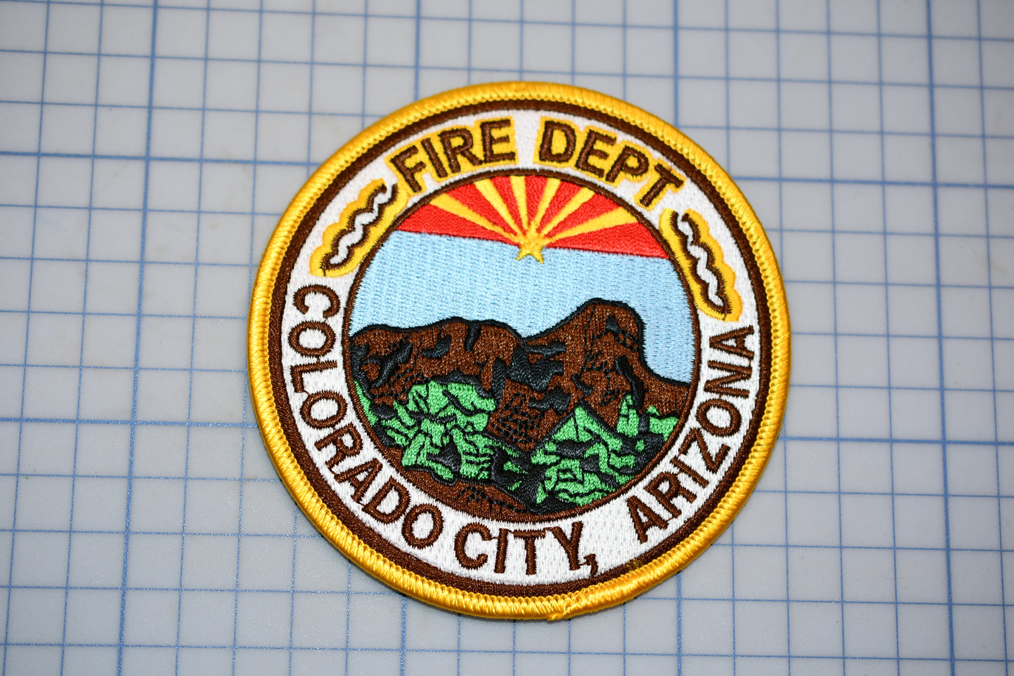 a fire department patch on a piece of paper