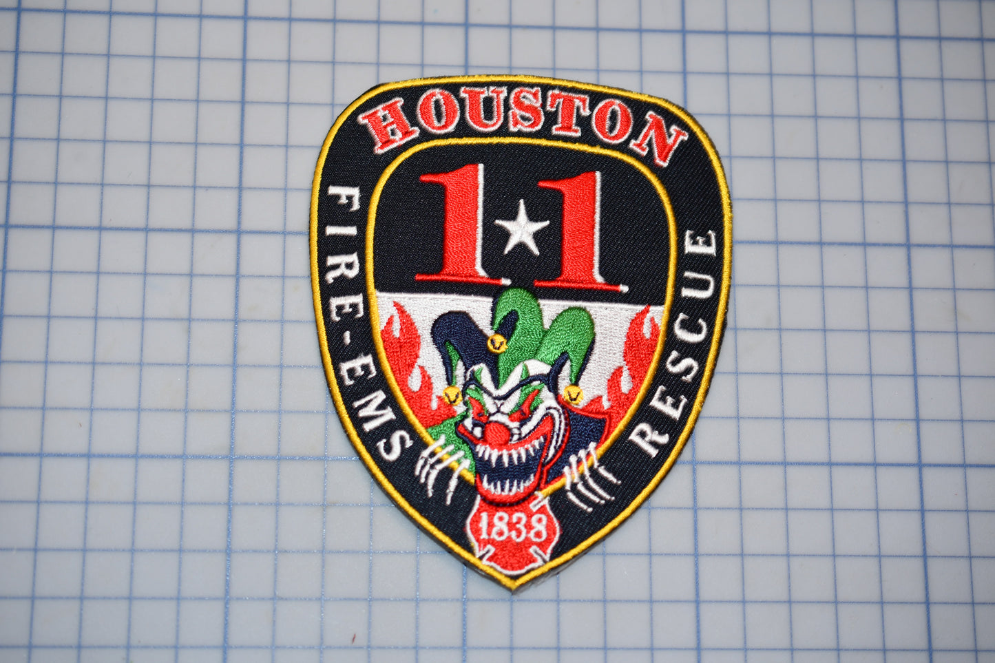 a houston fire department patch on a piece of paper