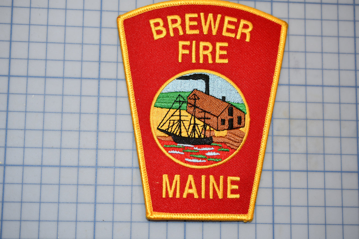a patch with a picture of a ship on it