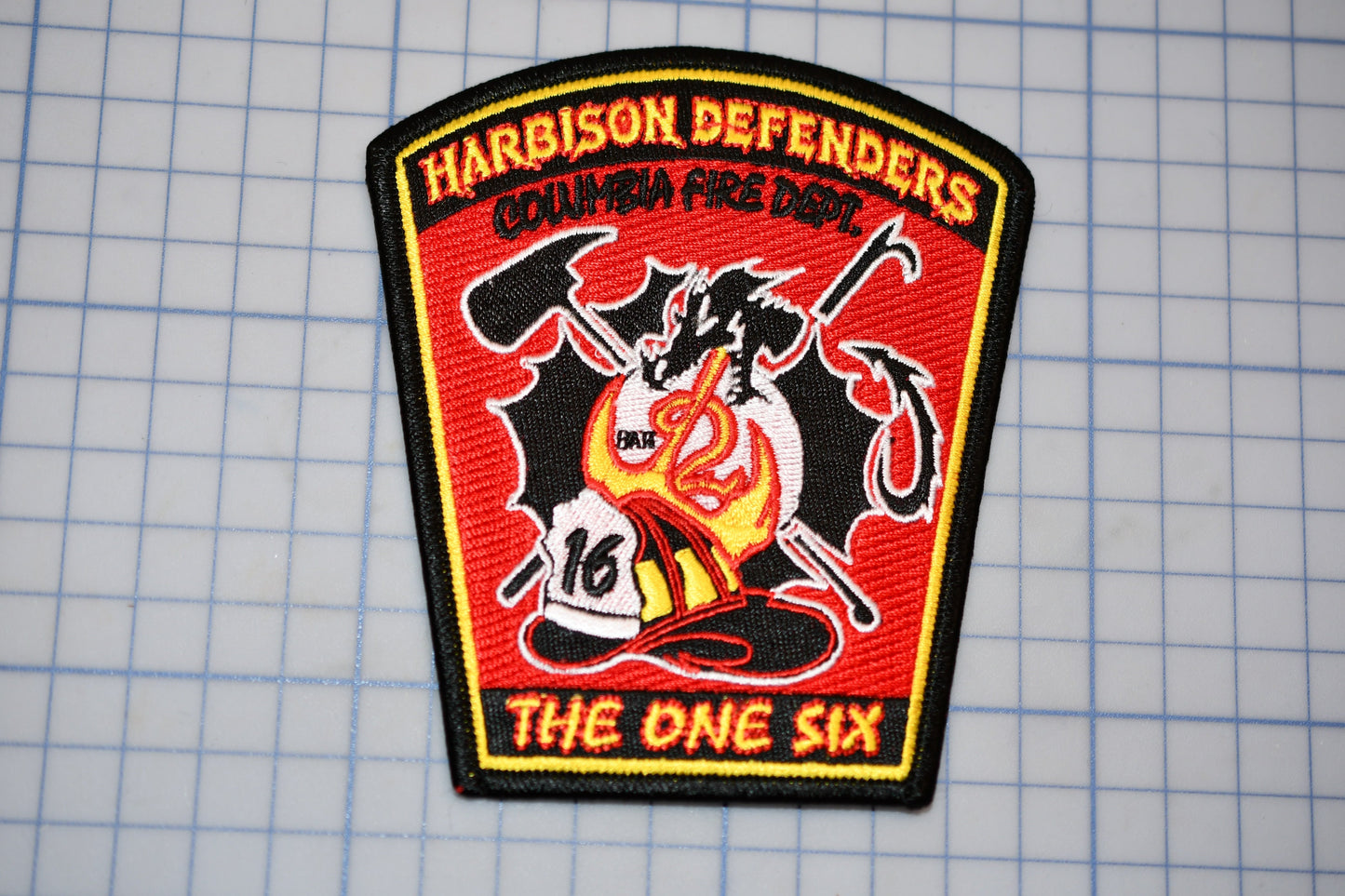 a patch with the words harrison defenders on it