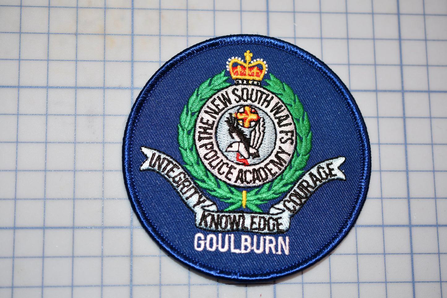 a patch with a picture of a crown on it