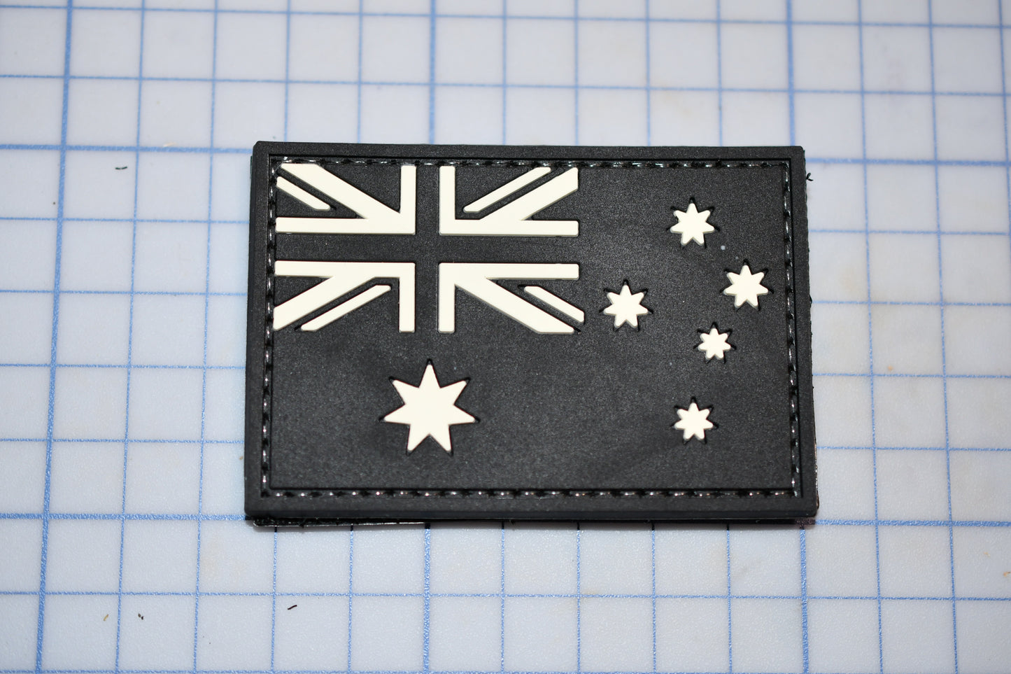 a black leather wallet with a flag of australia on it