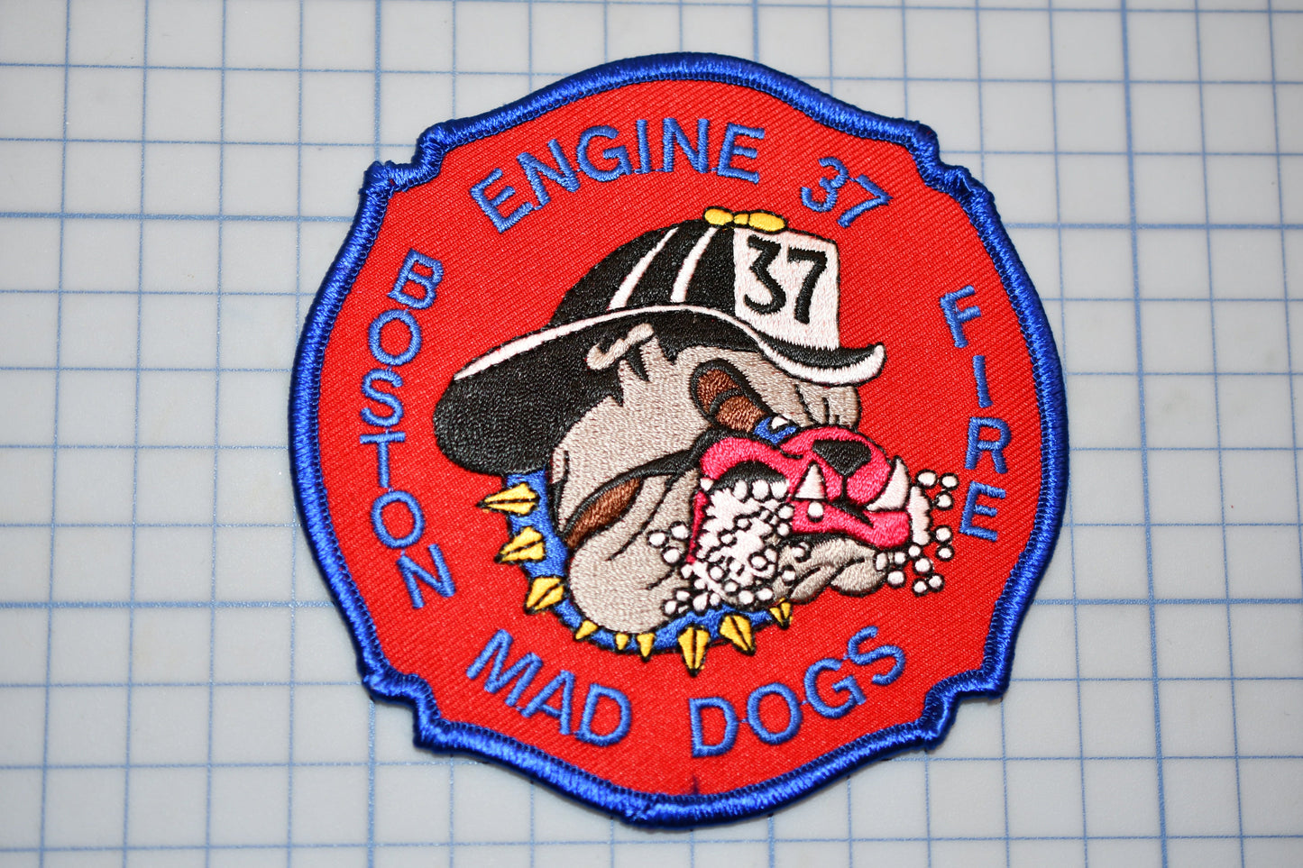 a patch with a picture of a dog wearing a hat