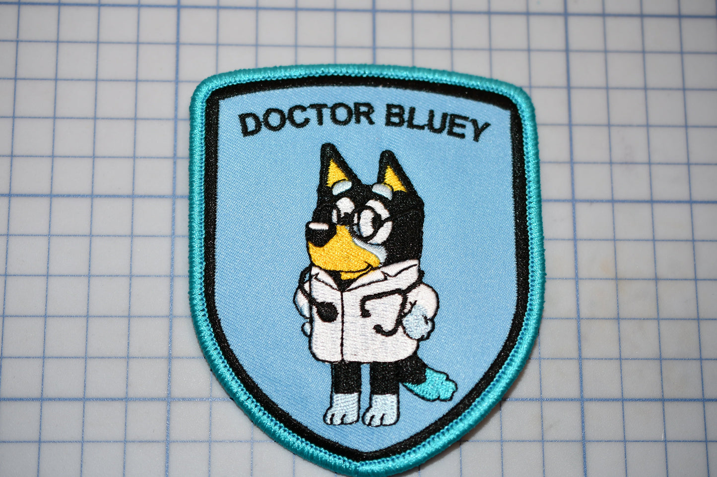a blue patch with a cartoon character on it