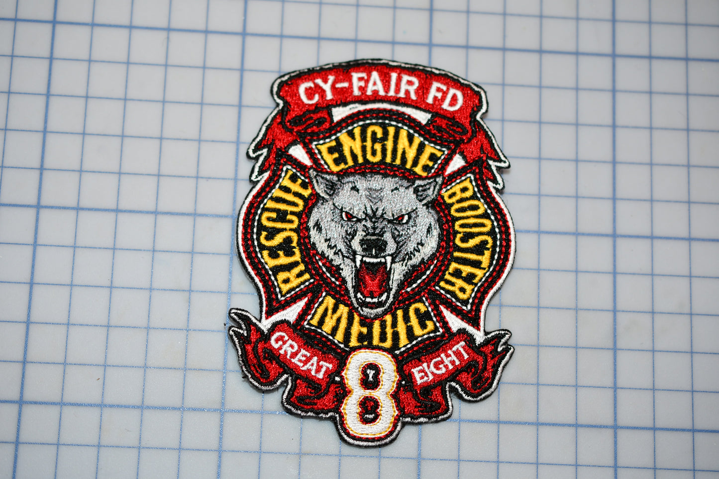 a patch with a picture of a wolf on it