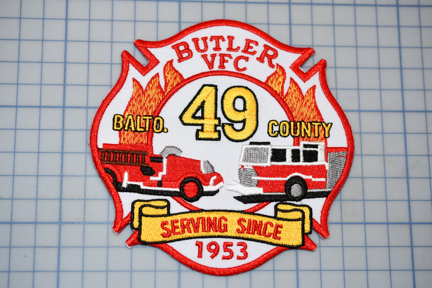 a patch with a firetruck and firetruck on it