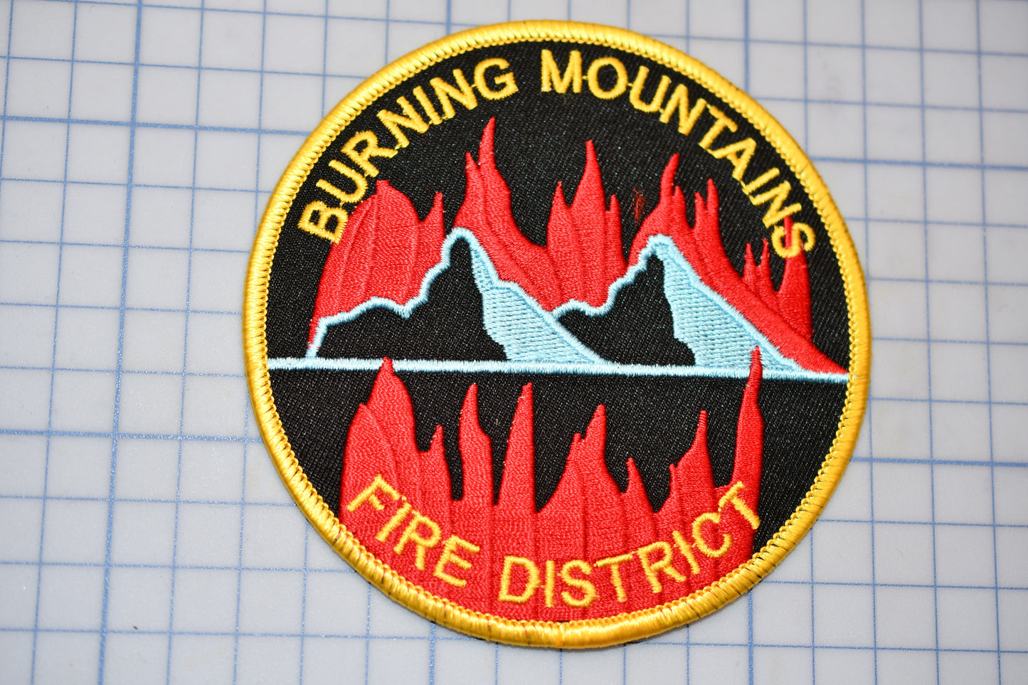 a patch that says burning mountains fire district