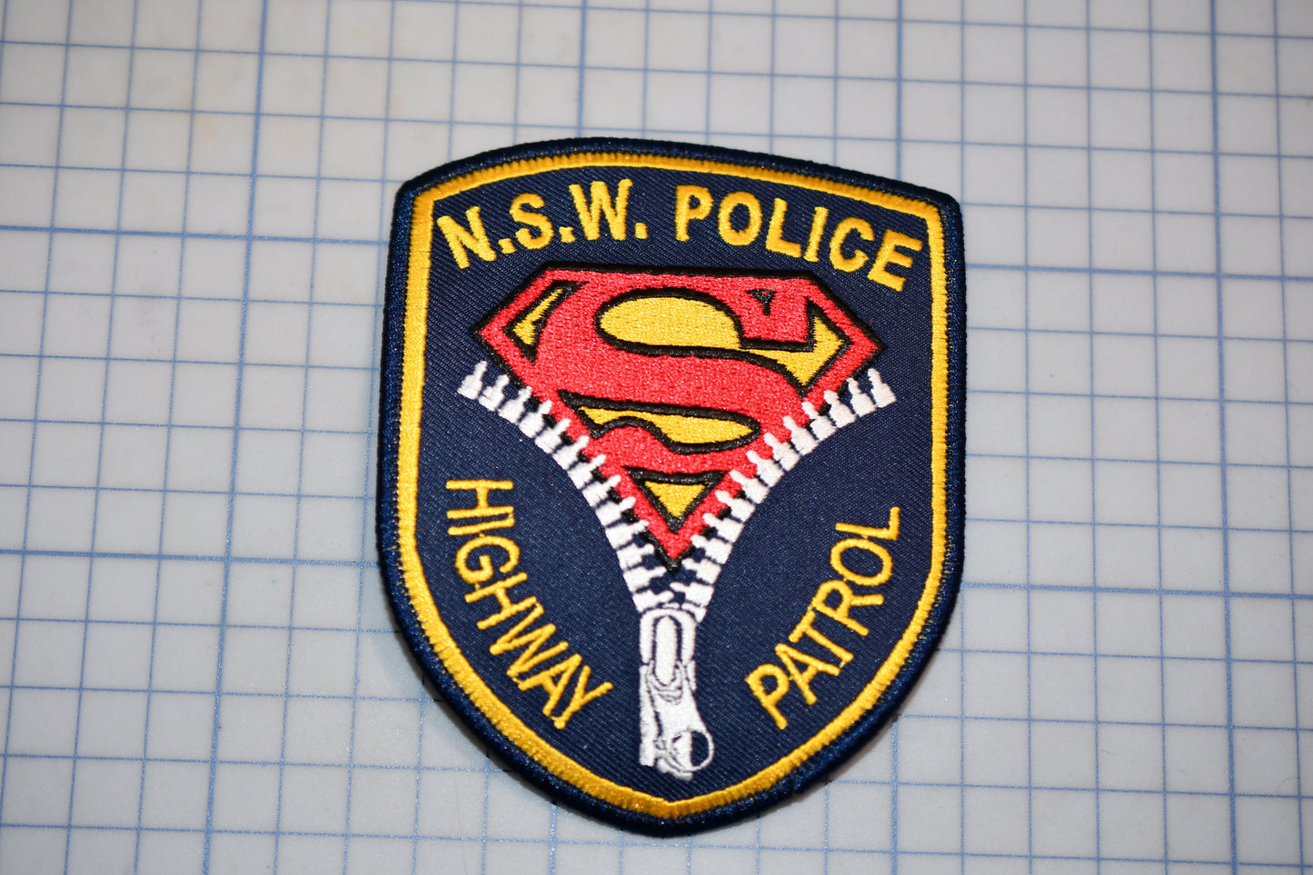 a police patch with a Superman logo, indicating that it is a Highway Patrol police patch.