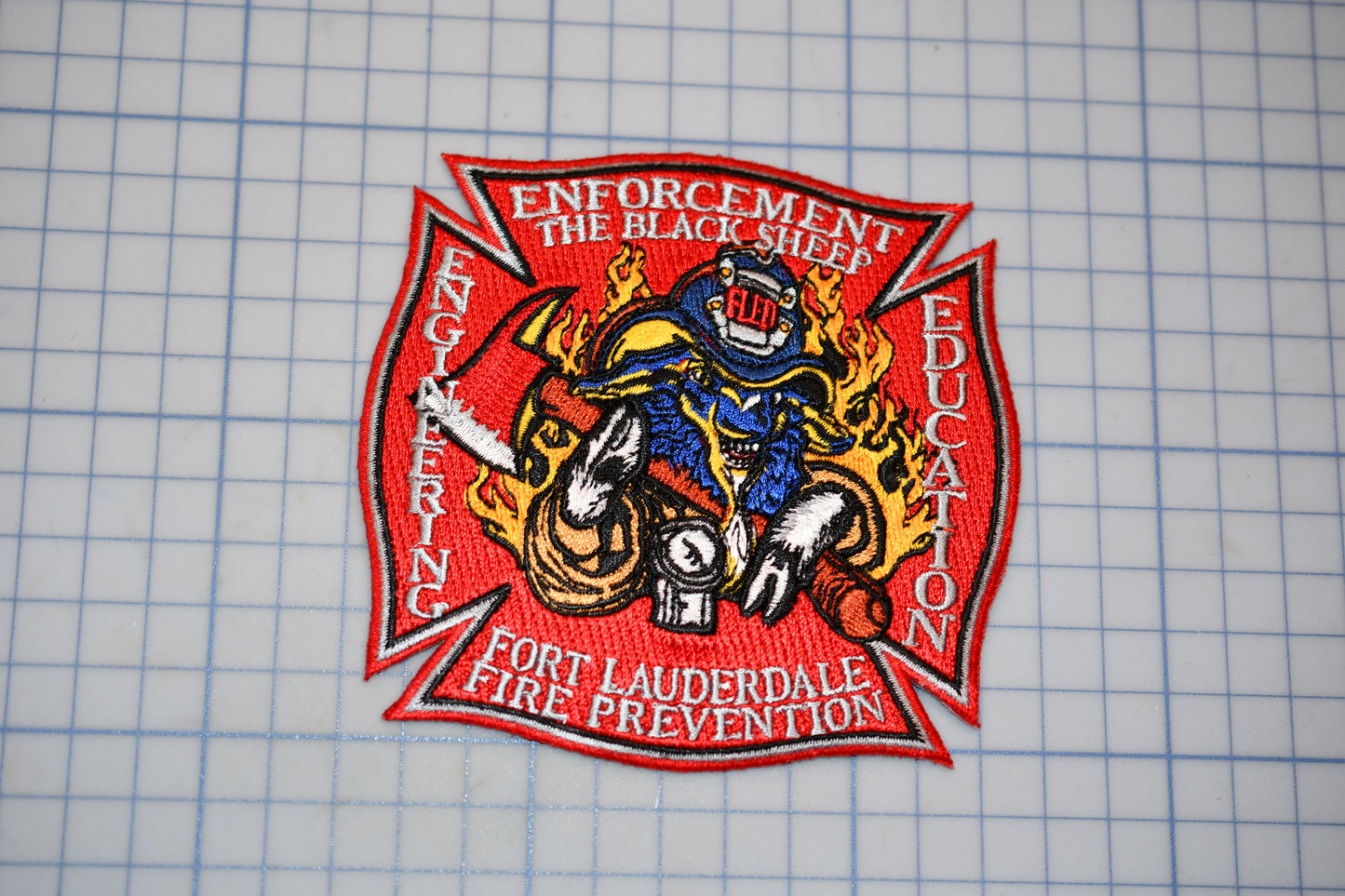a patch with a picture of a firefighter riding a motorcycle