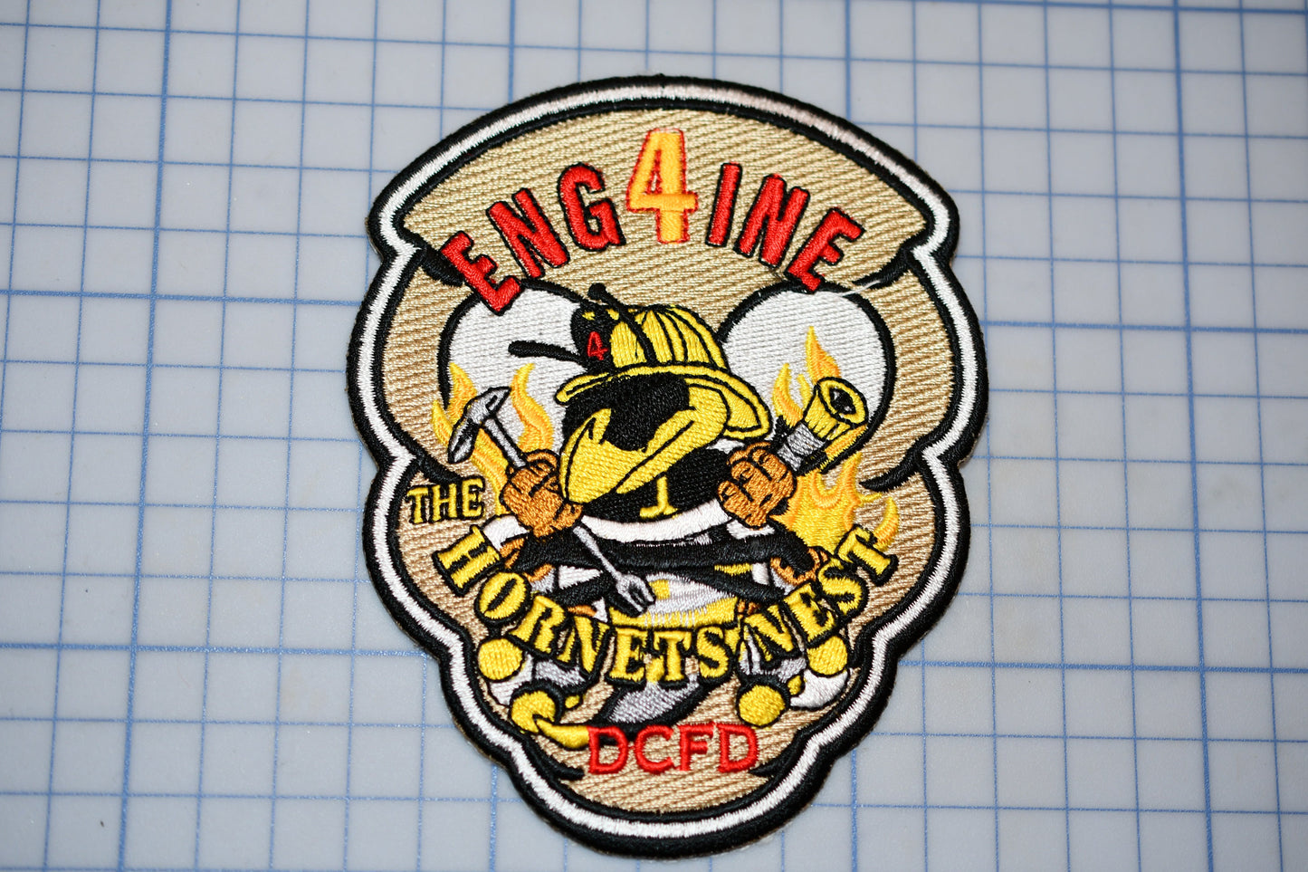 a patch with a picture of a firefighter on it