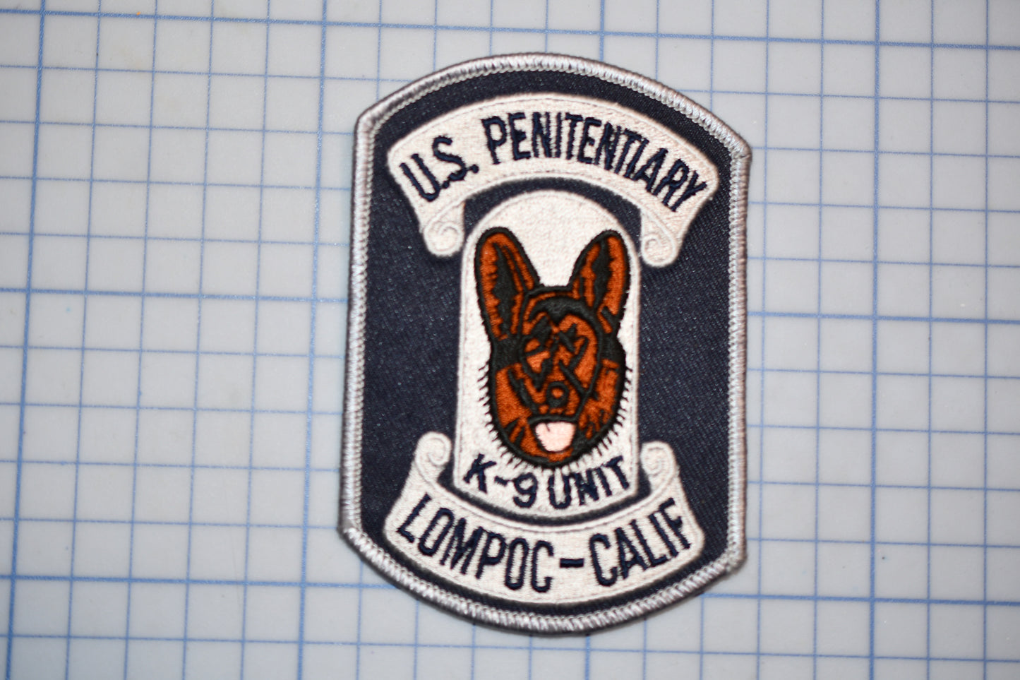 a U.S. Penitory K-9 unit patch from Lompoc-California.