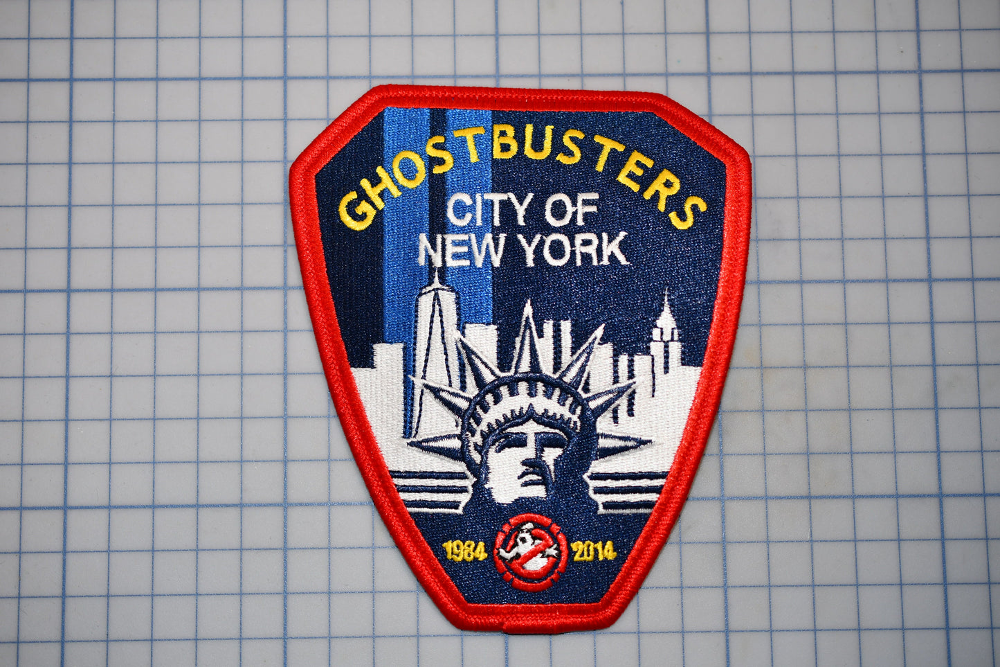 a patch with the words ghostbusters city of new york on it