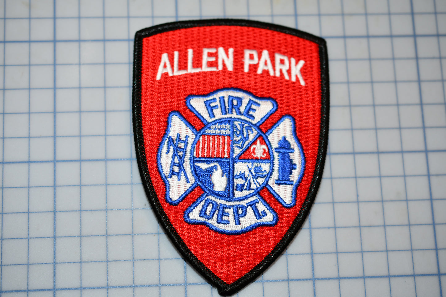 a patch with a fire department emblem on it