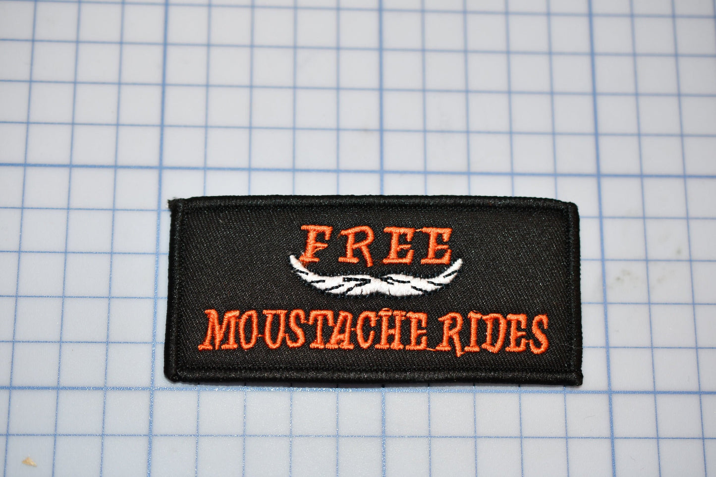 A "Free Moustache Rides" Sew On Biker Patch (B30-366)