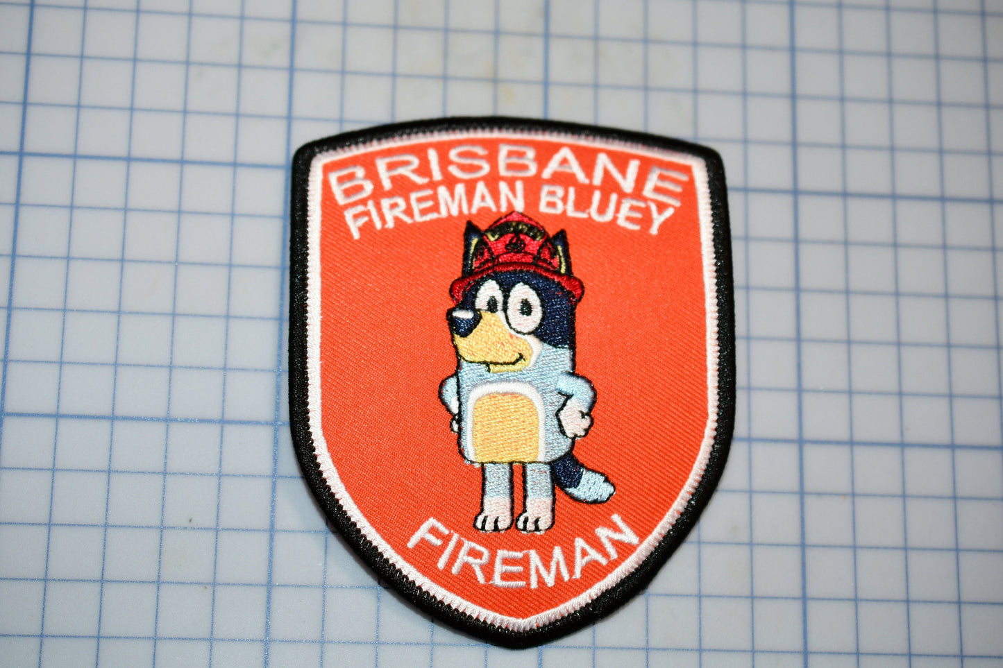 a patch with a picture of a fireman on it
