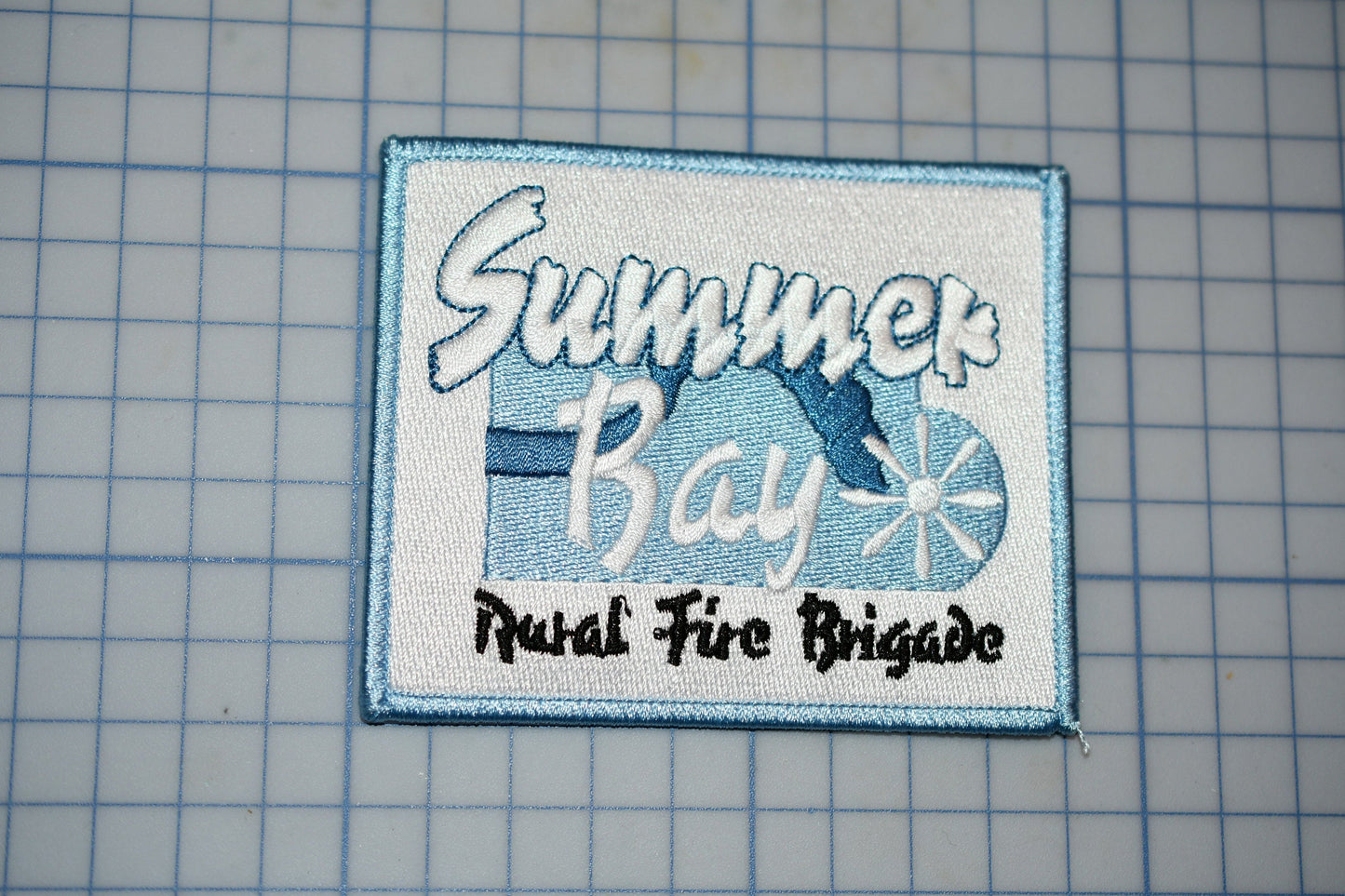 a picture of a patch with the words summer bay on it