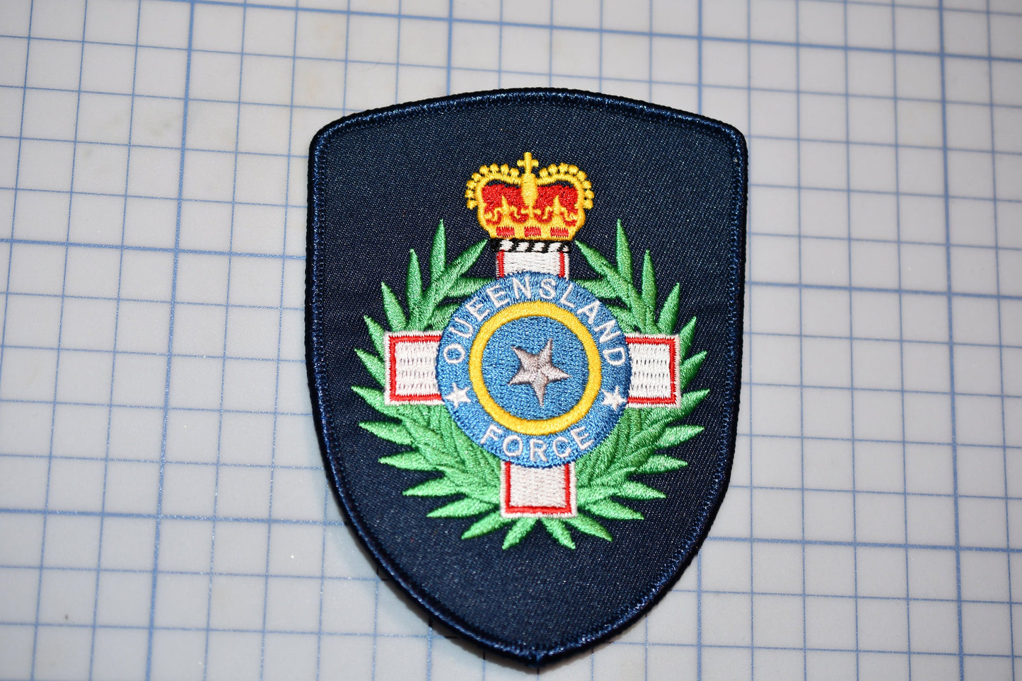 a patch with a crown and a star on it