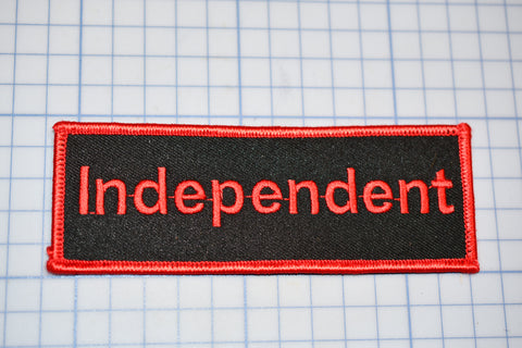 a red and black patch with the word independent on it