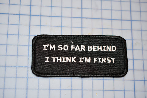 a patch that says i'm so far behind i think i'm first