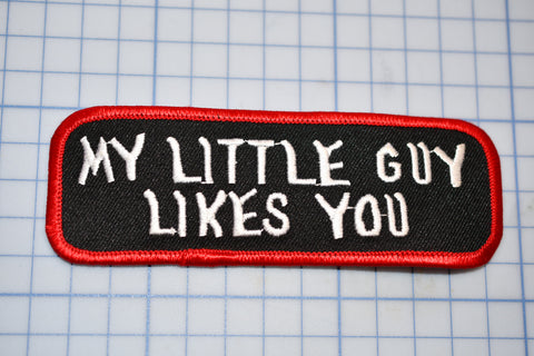 a black and red patch with white writing that says, my little guy likes you