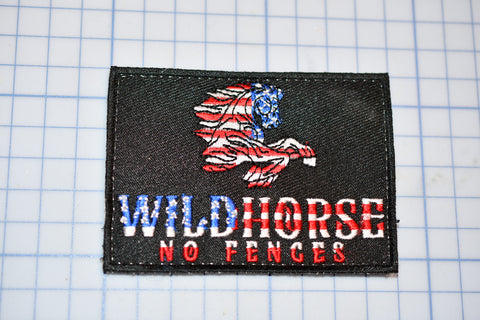 a patch with the words wild horse no fences on it
