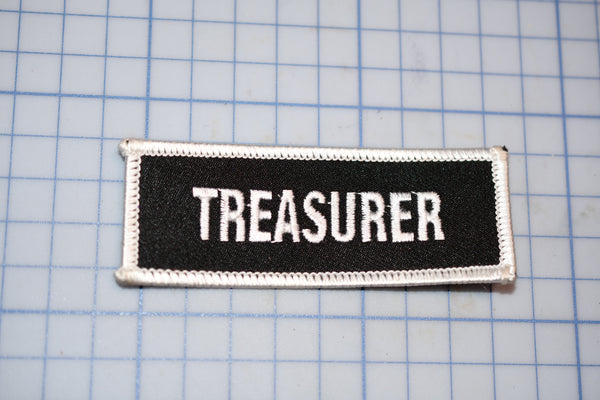 a black and white patch with the word treasures on it