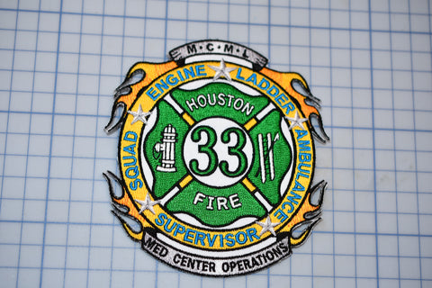 a fire department badge on a piece of paper