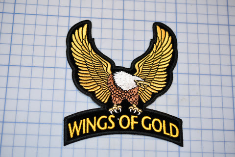 a picture of a wing of gold patch