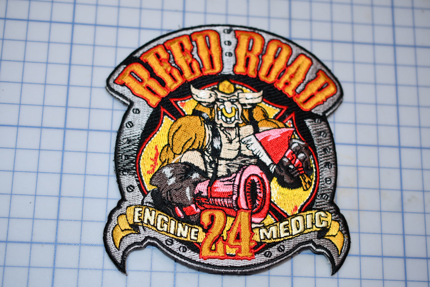 a patch with a picture of a fireman on it