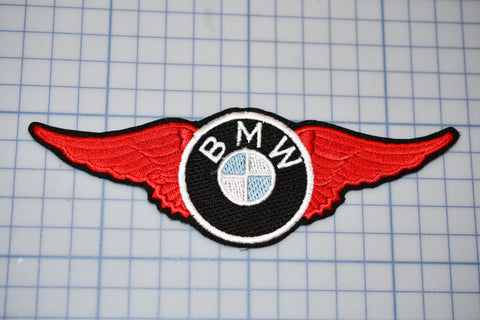 a bmw emblem is shown on a cutting board