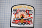 a patch with a fire truck and a building with flames, along with the text "We guard the yards" and "Engine 49" and "Fire truck 33".