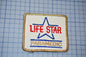 a patch with the text "LIFE STAR PARAMEDIC" and a star symbol, indicating that it is a patch related to the Life Star Paramedic program.