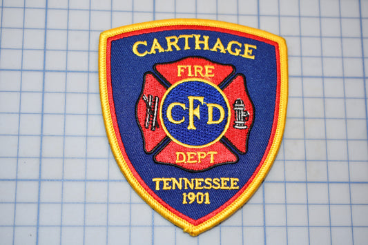 a fire department patch on a cutting board