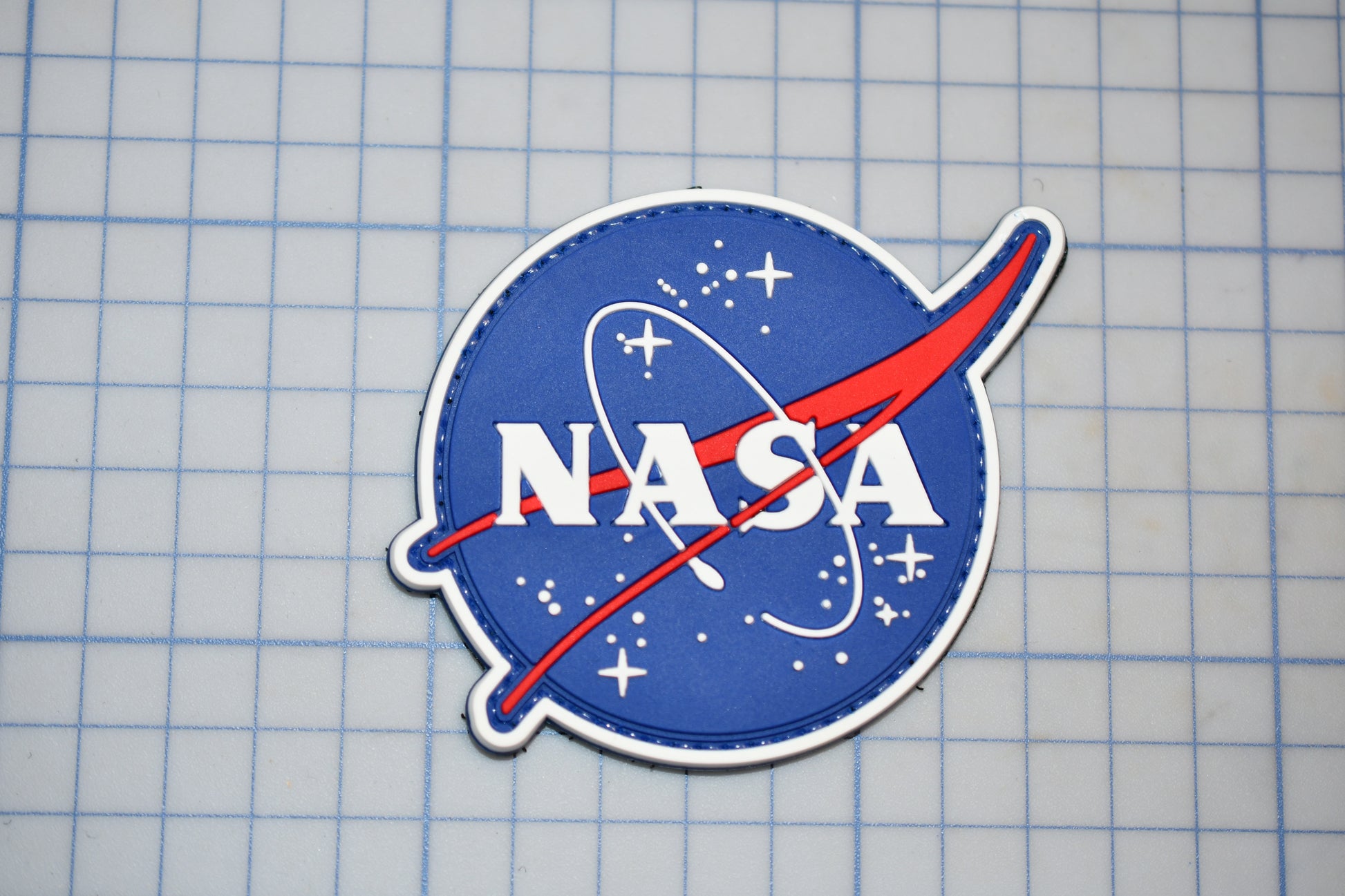 a nasa sticker on a piece of paper