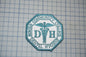 a patch with the text "Dental Hygiene" and a medical symbol, likely representing a college or institution related to dental hygiene.