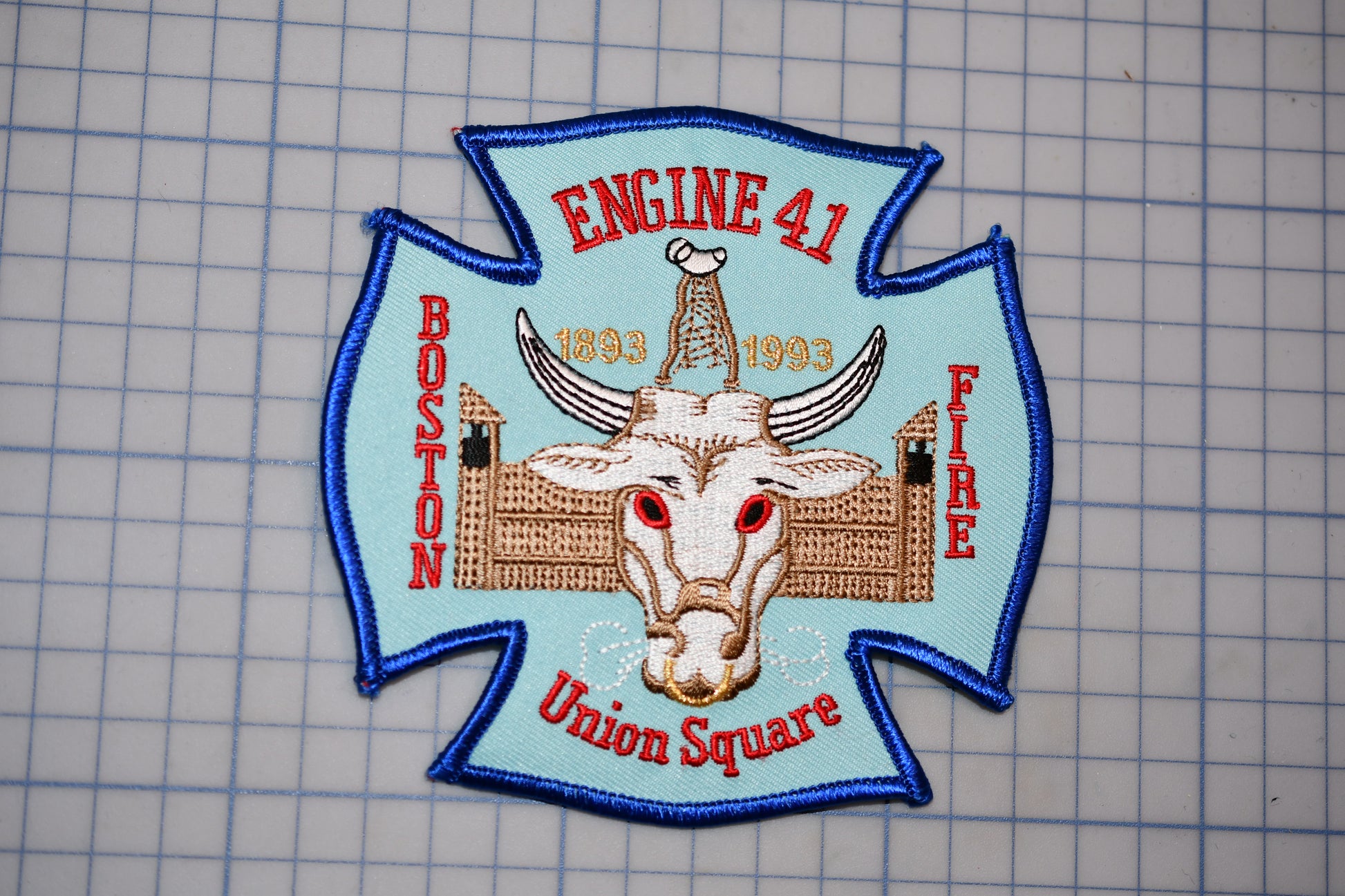 a fire department patch with a bull's head and the text "Engine 41 Boston Fire Union Square" on it.