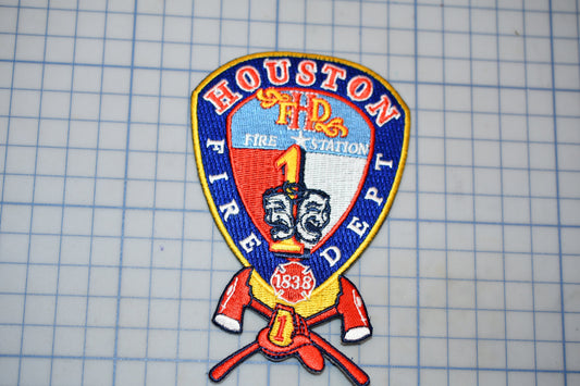 a fire department patch with the text "HOUSTON 1 FIRE DEPT."