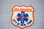 a patch with the text "EMS PARAMEDIC" and "CITY OF NEW YORK" on it, along with a blue and white medical symbol.